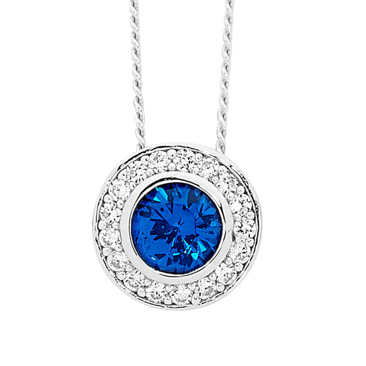 Sterling silver dark blue cubic zirconia solitare with white cubic zirconia around outside of pendan