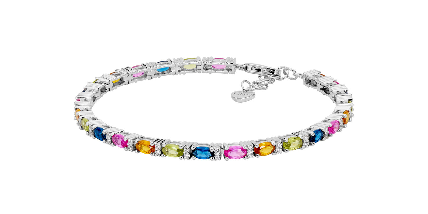 Sterling silver tennis bracelet with a multi-colored design, featuring oval and round cubic zirconia stones. Measures 18cm with an adjustable extension chain.