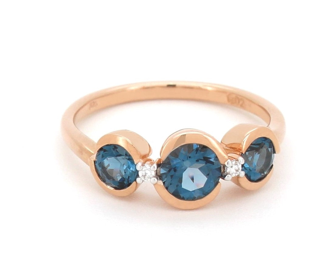 9Ct Rose Gold Ring With London Blue Topaz And Diamond.