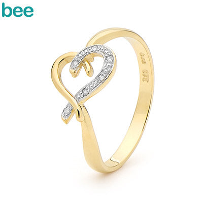 A solid gold heart with diamond chips pave-set across its surface for a full sparkle effect.