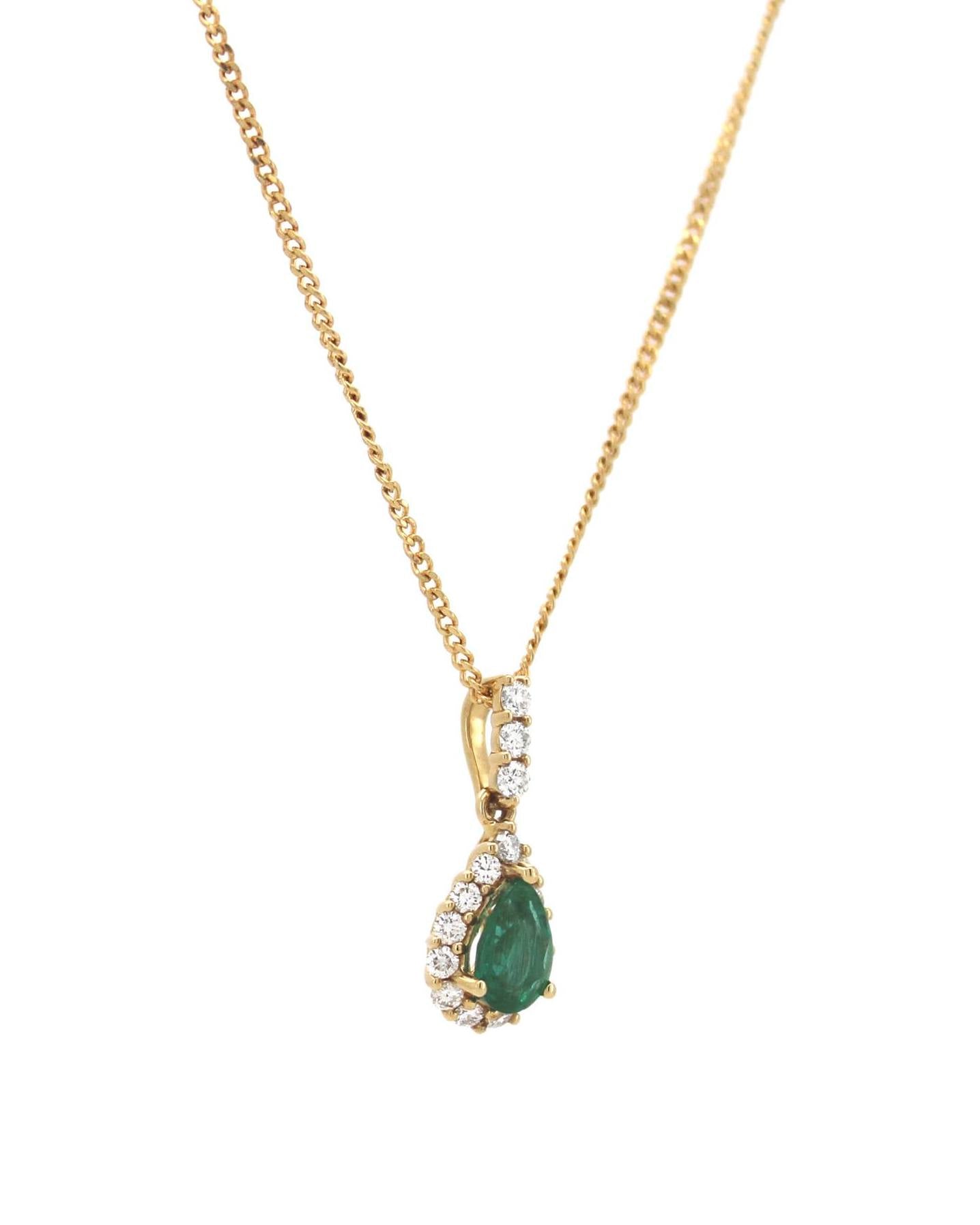 Elegant emerald and diamond pendant.